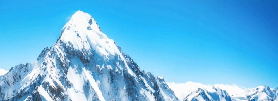 Snow-capped mountain peak under a clear blue sky