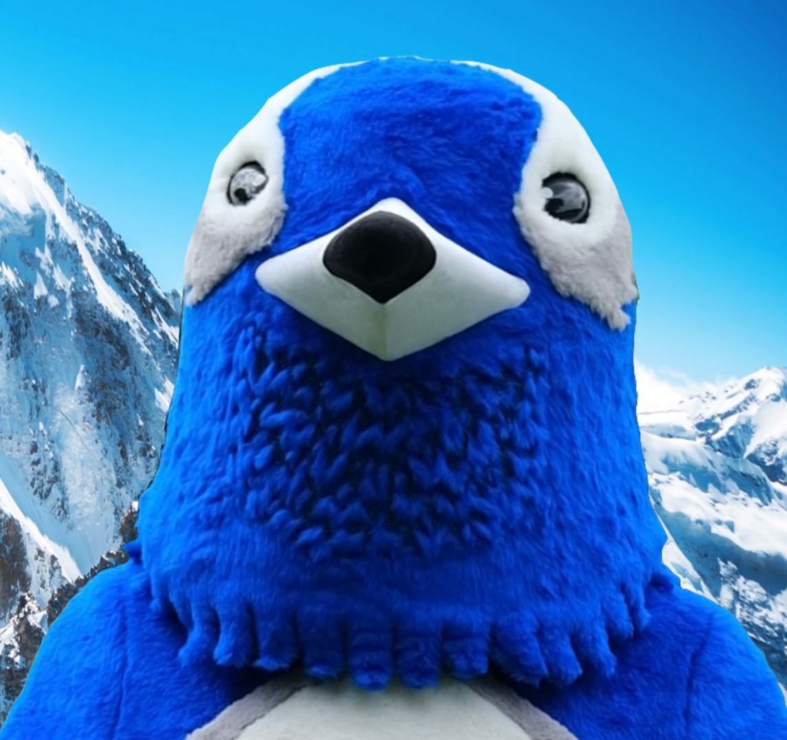 Blue Penguin mascot plush with a Canadian mountain background